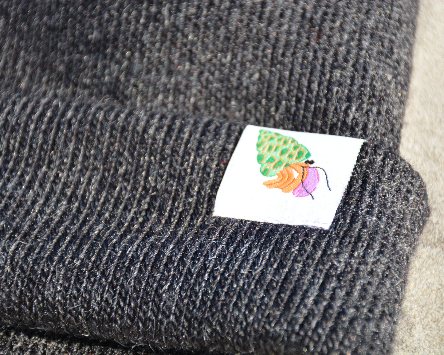 nortons-nest-black-beanie-hat-apparel-clothes-merch-hermit-crab-janie-groeling-pets-pet-supplies-beach-apparel-coastal-clothes