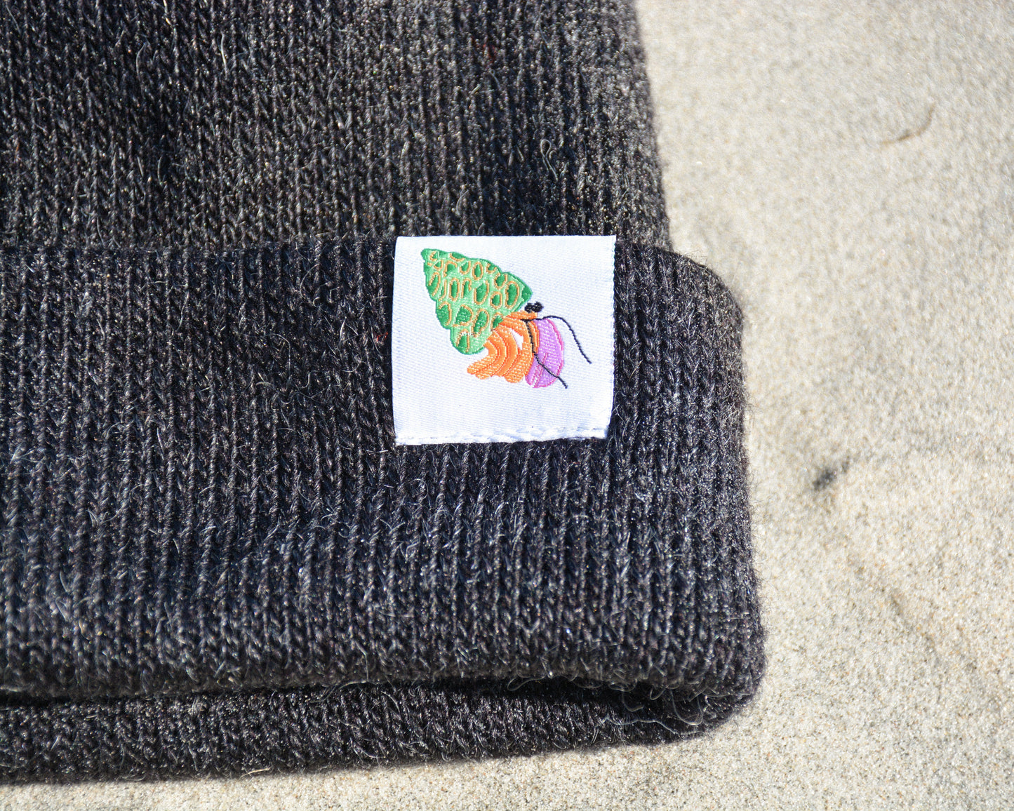 nortons-nest-black-beanie-hat-apparel-clothes-merch-hermit-crab-janie-groeling-pets-pet-supplies-beach-apparel-coastal-clothes