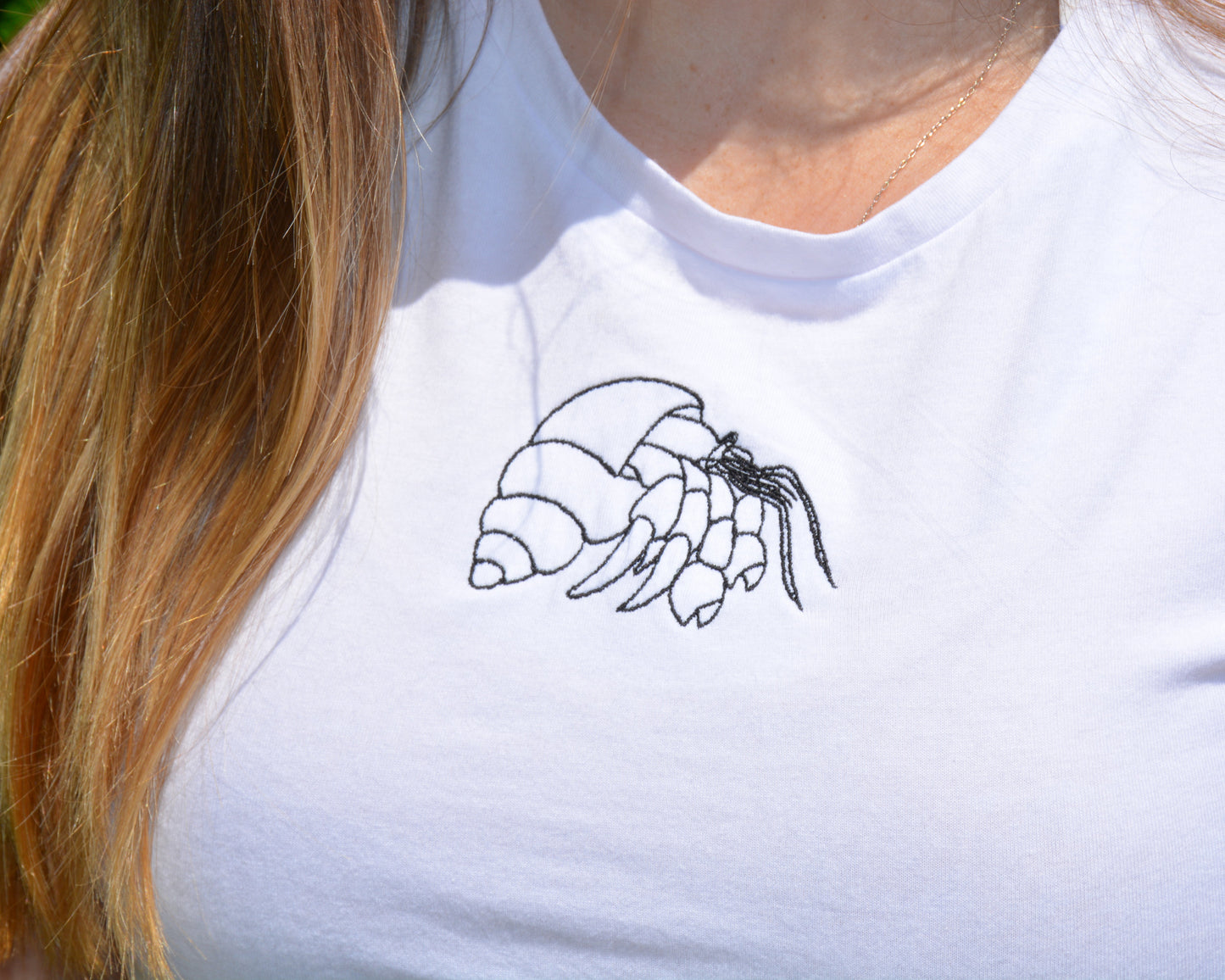 nortons-nest-janie-tee-shirt-top-baby-tee-cropped-hermit-crab-embroidered-shirt-white-black-navy-coastal-apparel-pet-supplies-janie-groeling-reptiles-crab-beach-clothes