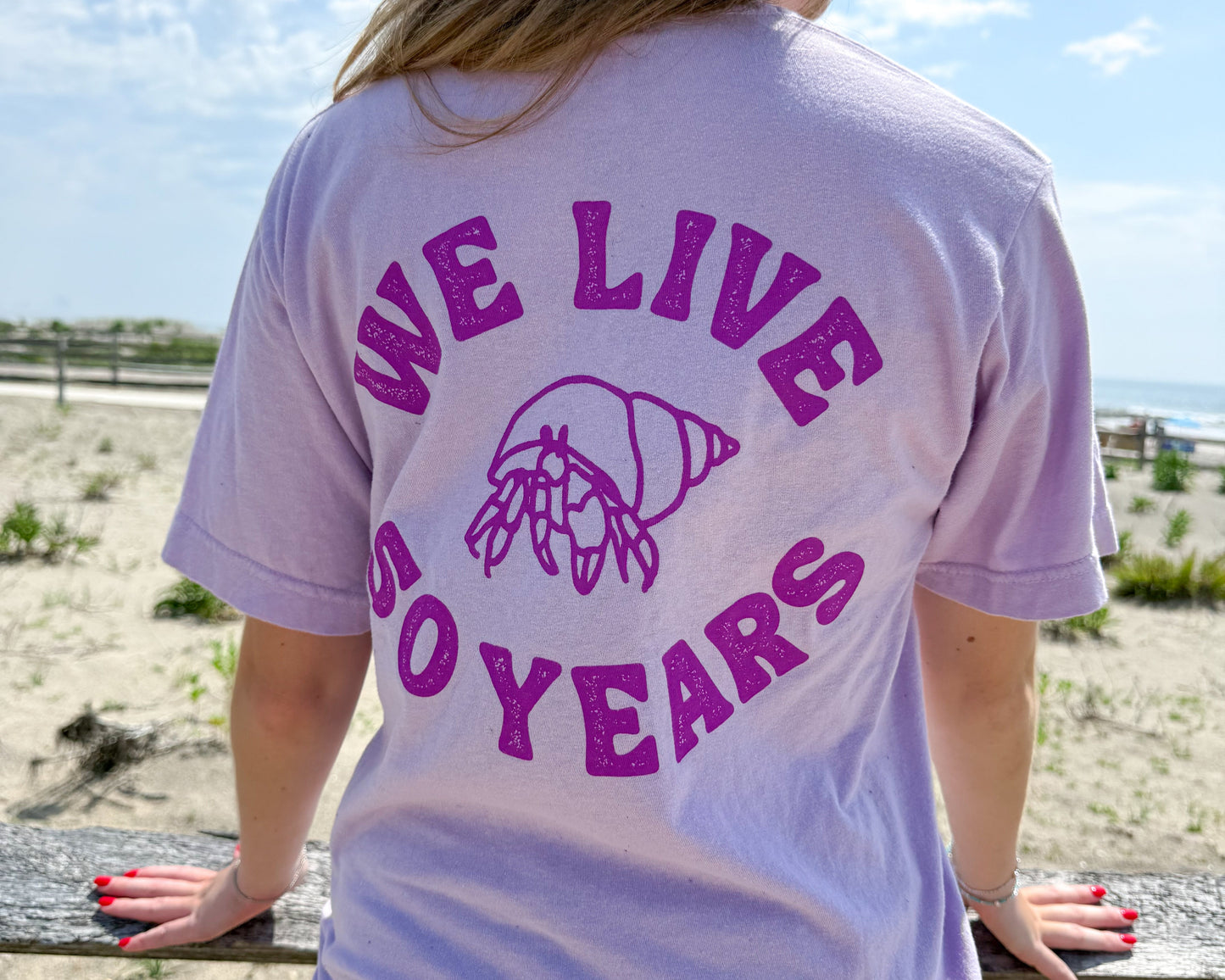 nortons-nest-we-live-50-years-hermit-crab-tee-shirt-top-merch-clothing-janie-groeling-purple