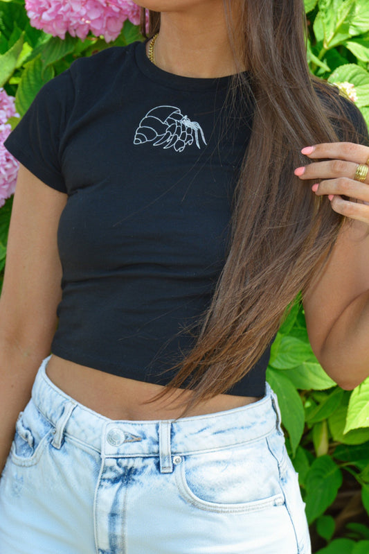 nortons-nest-janie-tee-shirt-top-baby-tee-cropped-hermit-crab-embroidered-shirt-white-black-navy-coastal-apparel-pet-supplies-janie-groeling-reptiles-crab-beach-clothes