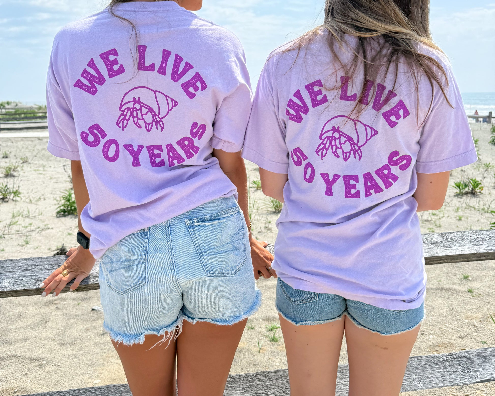 nortons-nest-we-live-50-years-hermit-crab-tee-shirt-top-merch-clothing-janie-groeling-purple